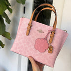 Mollie Tote Bag 25
In Signature Canvas With Charm