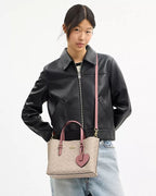 MOLLIE TOTE BAG 25 IN SIGNATURE CANVAS WITH HEART CHARM