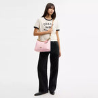 Laurel Shoulder Bag
In Signature Canvas With Charms