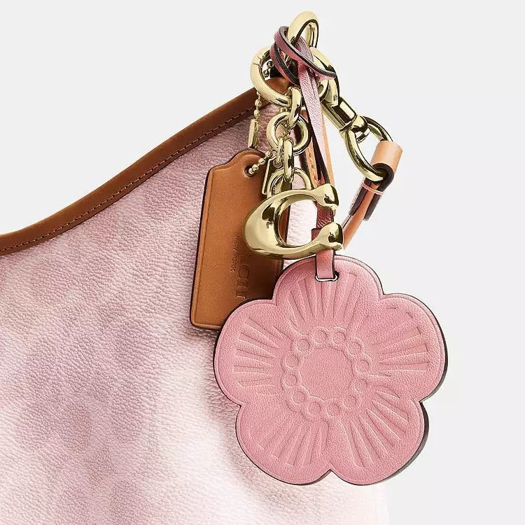 Laurel Shoulder Bag
In Signature Canvas With Charms
