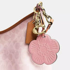 Laurel Shoulder Bag
In Signature Canvas With Charms