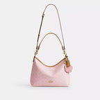 Laurel Shoulder Bag
In Signature Canvas With Charms